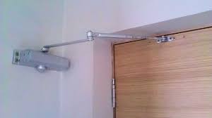 Wall-mounted door closer installation